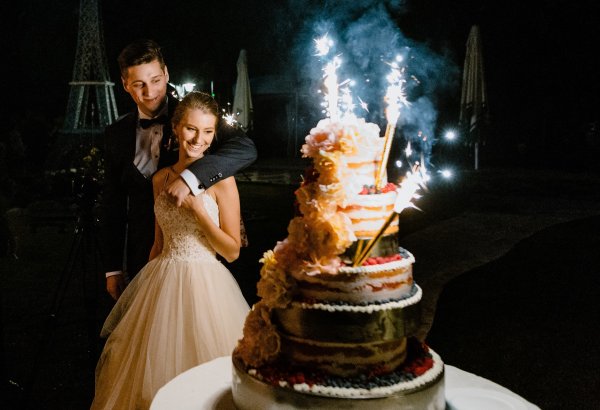 A cake in the garden with music and sparklers