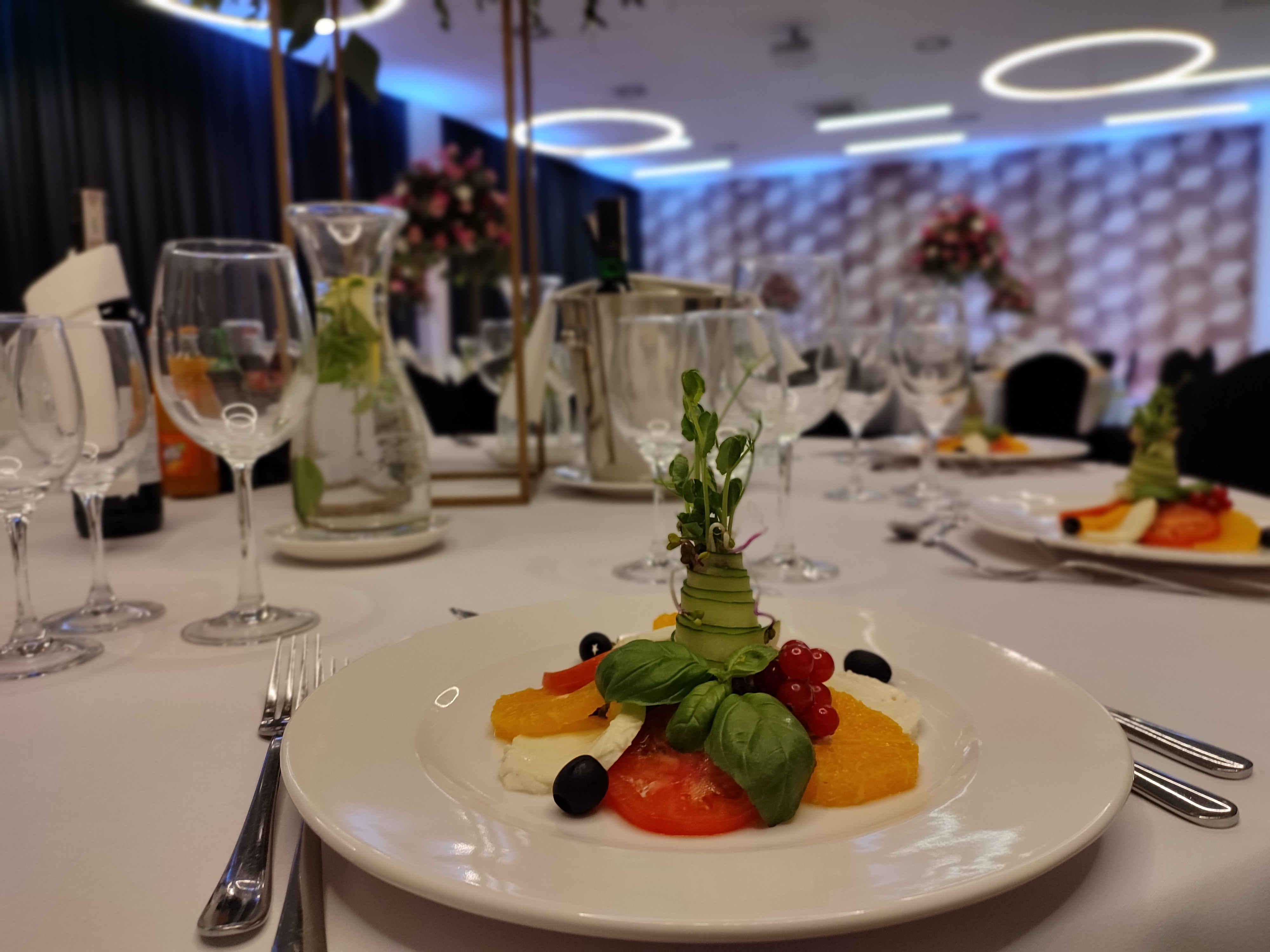 Elegant Italian-style appetizer — caprese with mozzarella, tomato and basil at a banquet in o3Hotel